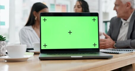 Business people, laptop and green screen mockup in team discussion for strategy, planning or meeting at office. Group of employees in teamwork collaboration with computer display and tracking markers