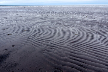 Northern seascape. Tersky coast of the White Sea. Murmansk region, Russia. The White Sea coast in Karelia in summer. Low tide. Littoral.