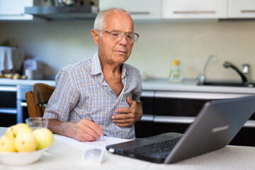 Senior man having online medical conversation