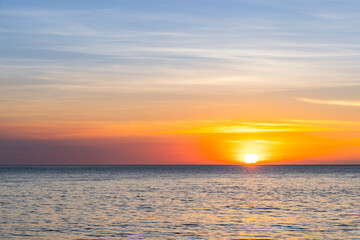 Naklejka na ściany i meble Beautiful sunset over the sea