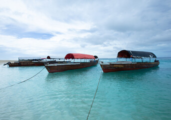 Boats at the beach on Zanzibar Island with stunning turquoise water