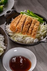 Savory Delights: Close-Up of Deep-Fried Orange Chicken Served on a Bed of Steamed White Rice, Captured in 4K Resolution
