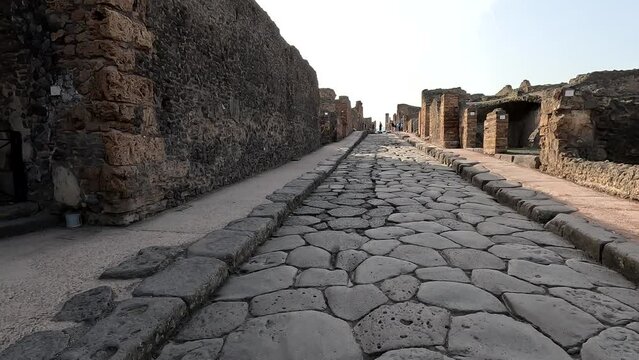 Famous ancient city of Pompeii (Scavi di Pompei) near Naples. Footpath road and ruins in ancient Pompeii, Campania, Italy