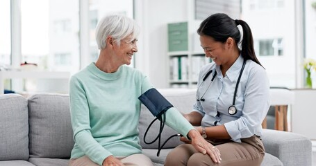 Doctor, senior patient and blood pressure check with consultation, talking and help, health in hospital office. Women at clinic, communication and cardiovascular healthcare, elderly care and support