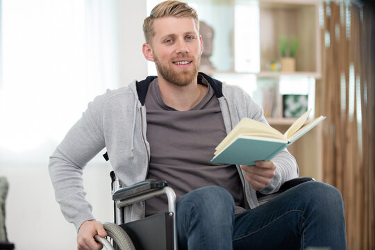 young manon wheelchair reading a book
