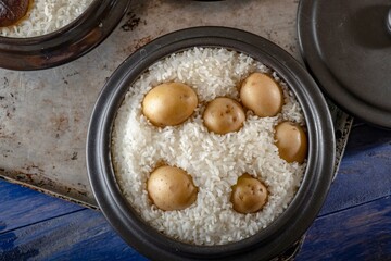 Savory Fusion: Close-Up of Steamed White Rice Cooked with Potatoes, Captured in 4K Resolution