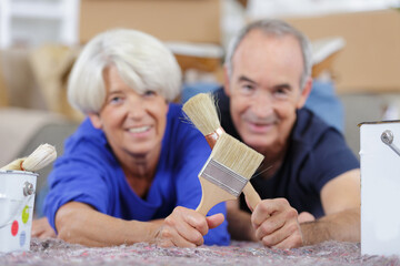 elderly couple with renovation tools