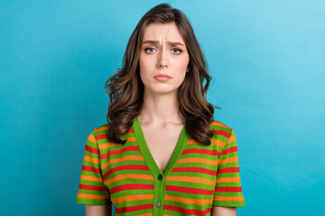 Photo of depressed offended dissatisfied girl with curly hairstyle wear striped shirt looks...