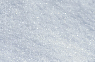 Background of fresh white snow. Winter snowflakes texture.