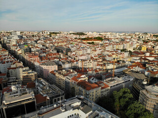 Fototapeta na wymiar Aerial view Lisboa city center. Roofs and housesAerial drone view. Flying over. High quality photo