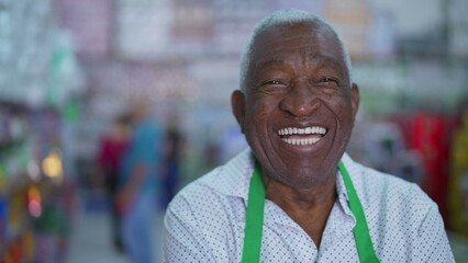 Joyful African American Senior Employee of Local Store, Smiling at Camera
