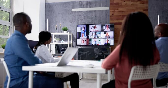 Group Of Businesspeople Having Video Conference