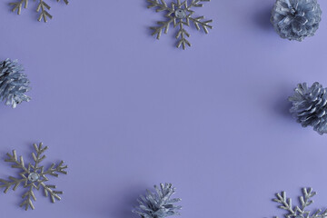 Background with christmas ornaments. Silver snowflakes and pine cones. Winter season concept, copy space - 627737121