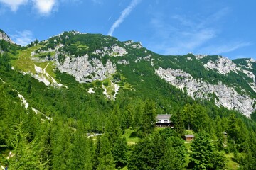 Fototapeta na wymiar View of mountains at Vrsic pass and Erjavceva koča bellow in Gorenjska, Slovenia