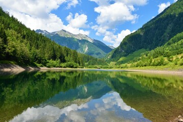 View of mountains in High Tauern, Ankogelgruppe, Austria and a reservoir at Mur