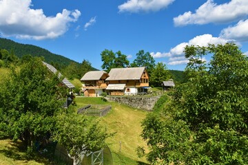 Fototapeta premium House in Podjelje village bellow Pokljuka in Slovenia