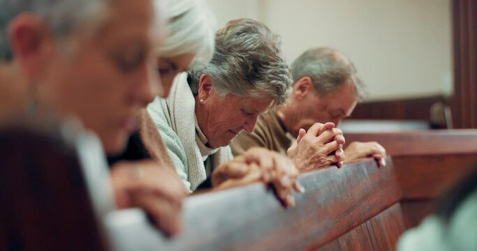 Senior, prayer and people in a church for a service, worship or spiritual support together. Praise, hope and a group of retirement elderly friends praying for peace, faith or gratitude as Christian