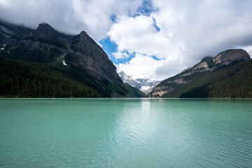 Beautiful glacial mountain lake with snow capped mountains 3
