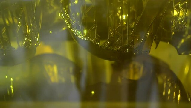 Working of photopolymer sla 3D printer. Platform with building object lowered into liquid photopolymer resins and hardened under ultraviolet laser. Progressive additive technology. 3D printer printing