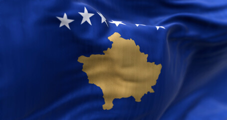 National flag of Kosovo waving in the wind on a clear day