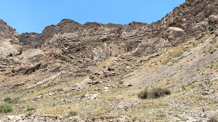 Sand and rocky mountains in the steppes of Asia