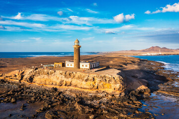 Punta de Jandia lighthouse from above, aerial blue sea, Fuerteventura, Canary Island, Spain. Punta Jandia lighthouse (Faro de Punta Jandia). Fuerteventura, Canary Island, Spain. - 627753178