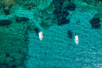 Moored fishing boats in the harbor at sunset, Lagos, The Algarve, Portugal. Yachts moored in the...