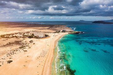 Aerial view of beach in Corralejo Park, Fuerteventura, Canary Islands. Corralejo Beach (Grandes Playas de Corralejo) on Fuerteventura, Canary Islands, Spain. Beautiful turquoise water and white sand.