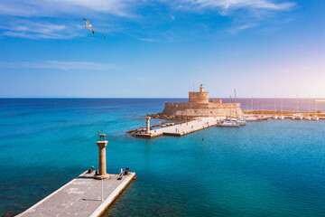 Mandraki port with deers statue, where The Colossus was standing and fort of St. Nicholas. Rhodes,...