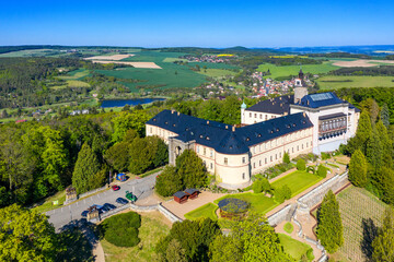 Fototapeta na wymiar Top view of medieval castle Zbiroh. Czech Republic. Picturesque landscape with imposing medieval Zbiroh Castle in Rokycany district, Pilsen Region, Czechia.