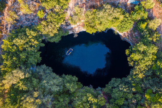 Melissani lake on Kefalonia island, Greece. Melissani Cave (Melissani Lake) near Sami village in Kefalonia island, Greece. Tourist boat on the lake in Melissani Cave, Kefalonia Island, Greece