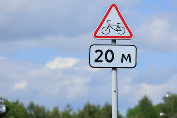 Information board or road sign for cyclists on the street on a summer day