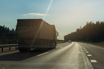 Cars, truck and highway road in the countryside