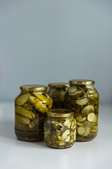 glass jar with pickled cucumbers