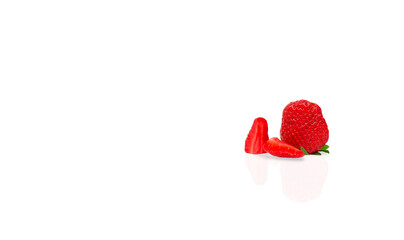 Fototapeta premium One whole Red ripe strawberries cut into pieces on a white background 
