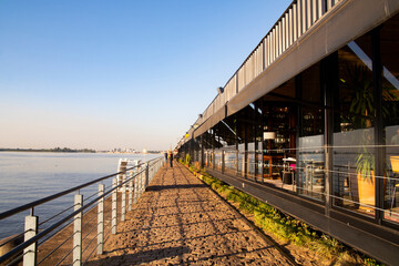 Porto Alegre, Brazil - May 25, 2023: Sunset at Cais Embarcadero Gastronomy and Entertainment Complex - New Guaiba Revitalized Waterfront or Orla do Guaiba, Porto Alegre, Rio Grande do Sul, Brazil