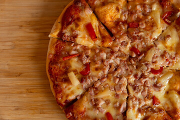 pizza with pineapple, ham and cheese