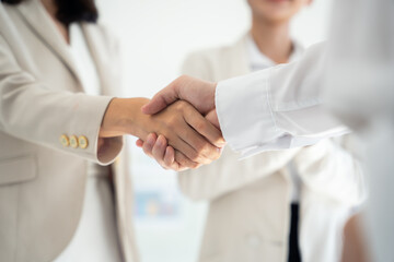 Business people shaking hands to seal a deal with partner. Business partnership concept.