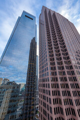 Obraz premium Buildings reflections in the glass walls of skyscrapers at sunset in downtown of Philadelphia, Pennsylvania, USA.