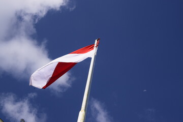 indonesian flag with blue sky