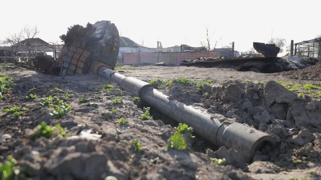 Destroyed houses after bomb attacks in Ukraine. Burned tank. Ukraine war. Velyka Dymerka, Kyiv oblast.