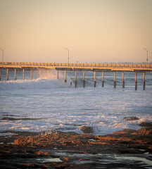 Fototapeta na wymiar Waves crashing through pier in San Diego