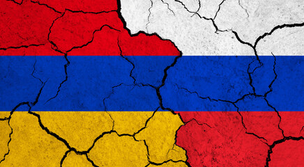 Flags of Armenia and Russia on cracked surface - politics, relationship concept
