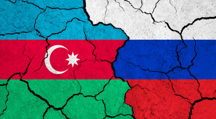 Flags of Azerbaijan and Russia on cracked surface - politics, relationship concept