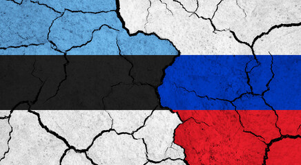 Flags of Estonia and Russia on cracked surface - politics, relationship concept