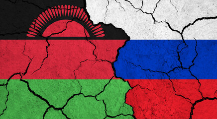 Flags of Malawi and Russia on cracked surface - politics, relationship concept