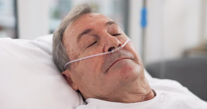 Oxygen, hospital bed and senior man sleeping with ventilation and breathing tube support in a clinic. Elderly patient, medical care and emergency room with male person at a doctor for healthcare