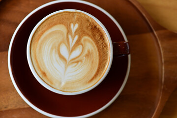 high angle view of coffee cup on wood grain table Drinking Concept: Hot Coffee, Latte, Espresso, Cappuccino