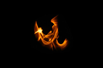 One wing in flame. Wings in Flame and Fire. Black background. Copy space. Out of focus