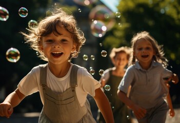 Children running in a park with soap bubbles